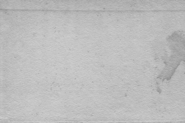 Cardboard white texture close-up. Light old paper background. Grunge concrete wall. Vintage blank wallpaper.