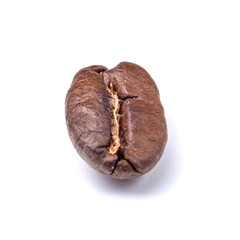 Roasted coffee beans on a white background. Close-up photo