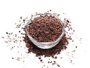Chopped cocoa pile in glass bowl isolated on white background