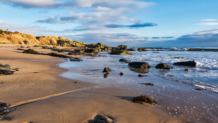 Dornoch beach and a rocky headland