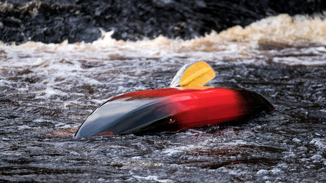 Capsized kayak on the River Brora