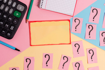 Mathematics stuff and writing equipment above pastel colours background