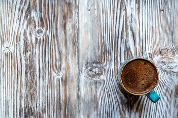 Cup of coffee on wooden rustic background, with copy space