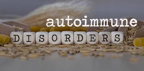 Words AUTOIMMUNE DISORDERS  composed of wooden dices.