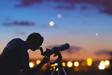 Fotobehang Astronomer with a telescope watching at the stars and Moon. My astronomy work. © astrosystem