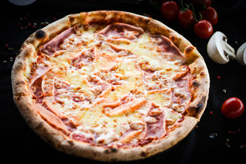 tasty italian pizza with prosciutto & cheese
