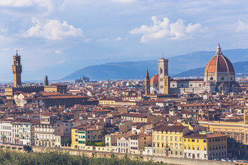 Fototapeta na wymiar Florence, Tuscany, Italy: Panoramic view of the old town with towering Cathedral of Santa Maria del Fiore and Giotto's bell tower