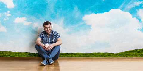 Young man sitting on floor, a moment for relax concept