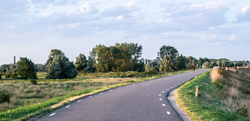 Fototapeta na wymiar Road on a typical Dutch dyke