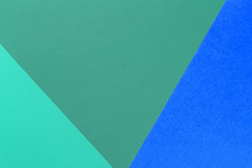 Paper blue, green empty background, geometrically located. Color blank for presentations, copy space.