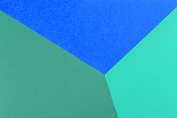 Paper blue, green empty background, geometrically located. Color blank for presentations, copy space.