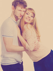 Happy enamoured couple hugging each other.