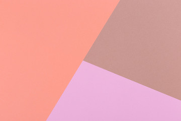 Paper orange, pink, brown empty background, geometrically located. Color blank for presentations, copy space.