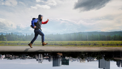 Fototapeta na wymiar Travelling tourist with his backpack