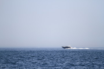 The Yatch is cruising at the Horizon