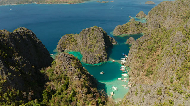 Aerial drone lagoons and coves with blue water among the rocks. lagoon, Kayangan Lake.mountains covered with forests. Seascape, tropical landscape. Palawan, Philippines, Busuanga © Alex Traveler