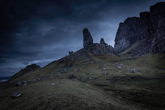 Old Man of Storr at twilight.Famous rock formation landmark in Portree on Isle of Skye, Scotland,UK.Dark and dramatic landscape image with atmospheric mood.Popular tourist attraction.