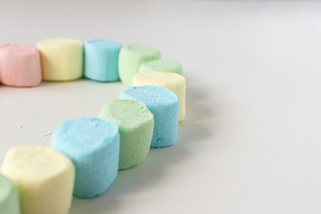 Sweet heart made of marshmallows on a white background. Marshmallow figures.