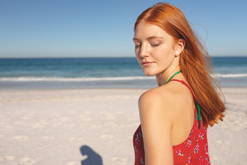 Beautiful woman standing on the beach