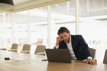 Businessman using laptop in the conference room at office