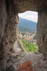 View of the village of Bellinzona through the window of the fortress.