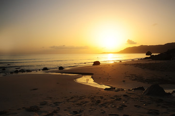 Dawn on the wild beach of an Indian Ocean island. Wild untouched nature.