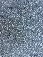 Frost on metal car top with blur effect in black and white. background and texture for design.