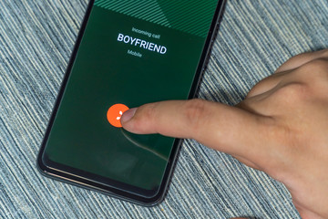 Homosexual realtionship break up concept - rejecting a call from boyfriend