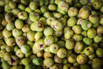 Fresh ripe figs as background, top view