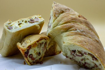 Naples. Il Casatiello a pizza stuffed with ham, cheese, eggs, salami, pepper.