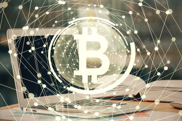 Double exposure of blockchain and crypto economy theme hologram and table with computer background. Concept of bitcoin cryptocurrency.