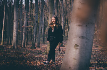 Woman walking against autumn forest
