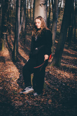 Woman walking against autumn forest