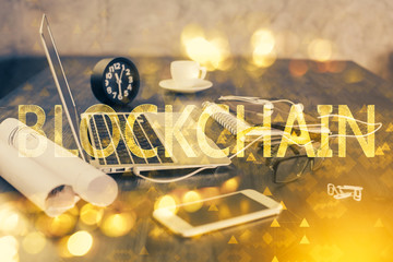 Double exposure of blockchain and crypto economy theme hologram and table with computer background....
