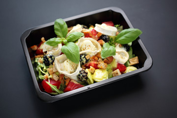 Catering. Lunch box, tasty fruit salad and blue cheese.