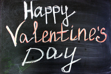 Fototapeta premium Love. I love you. Message of love. The inscription on the blackboard with chalk. Valentine's day theme. Dark grunge texture background. Copy space.