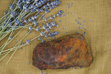 Bouquet of dry lavender and rock form Roussillon. Stone with impurities of ocher. Autumn in...