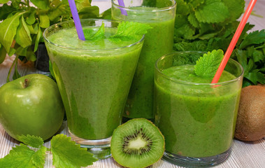 Kiwi, banana, apple and fresh greens smoothie for detox cleansing