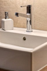 Fototapeta na wymiar Interior of a modern bathroom with white sink
