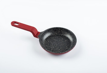 An empty omelette pan on a white background