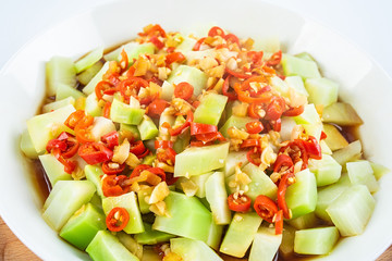 Chinese dish of sauteed kale root on white background