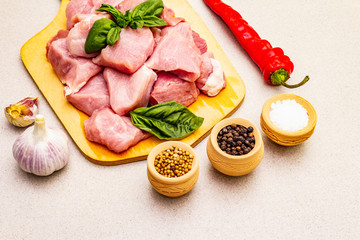 Raw pork neck, cut into pieces with fresh vegetables and dry spice