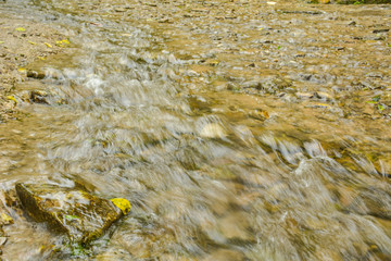 Fast water runs on stones