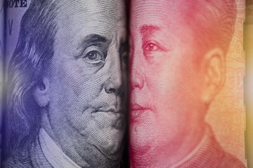 Face to face of Benjamin Franklin and Mao Tse tung from US dollar and China Yuan banknote. It is symbol of economic tariffs trade war.