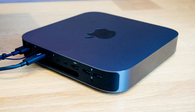 Paris, France - Jul 24, 2019: Rear view of new Mac Mini personal computer on the wooden table