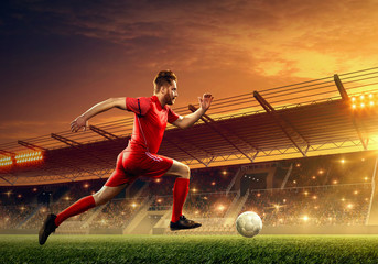 Soccer player in action on a stadium. Dribble the ball. Soccer game. Sports championship. Soccer...