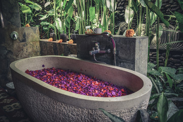 Bath tub with flower petals