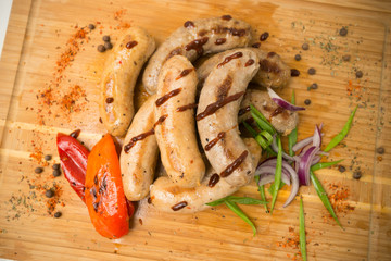 sausages for frying. fried sausages with vegetables - 284327609