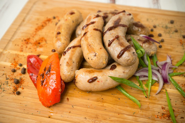 sausages for frying. fried sausages with vegetables - 284327622
