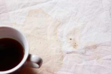 black coffee with stain on fabric from drinking 